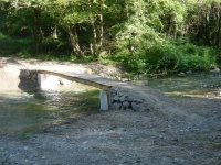 A pedestrian and for cicle bridge made of wooden planks